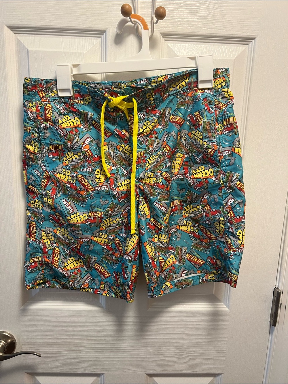 Turquoise Graphic Swim Shorts with Yellow Ocean Print